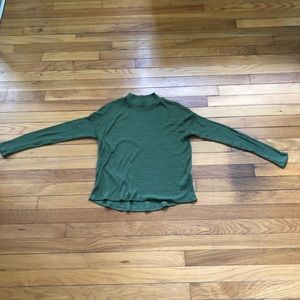 Cute teen girl's green turtleneck.